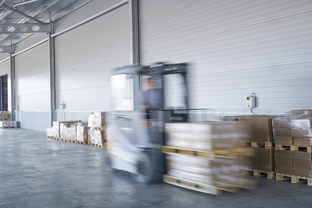 Forklift truck loading lorry