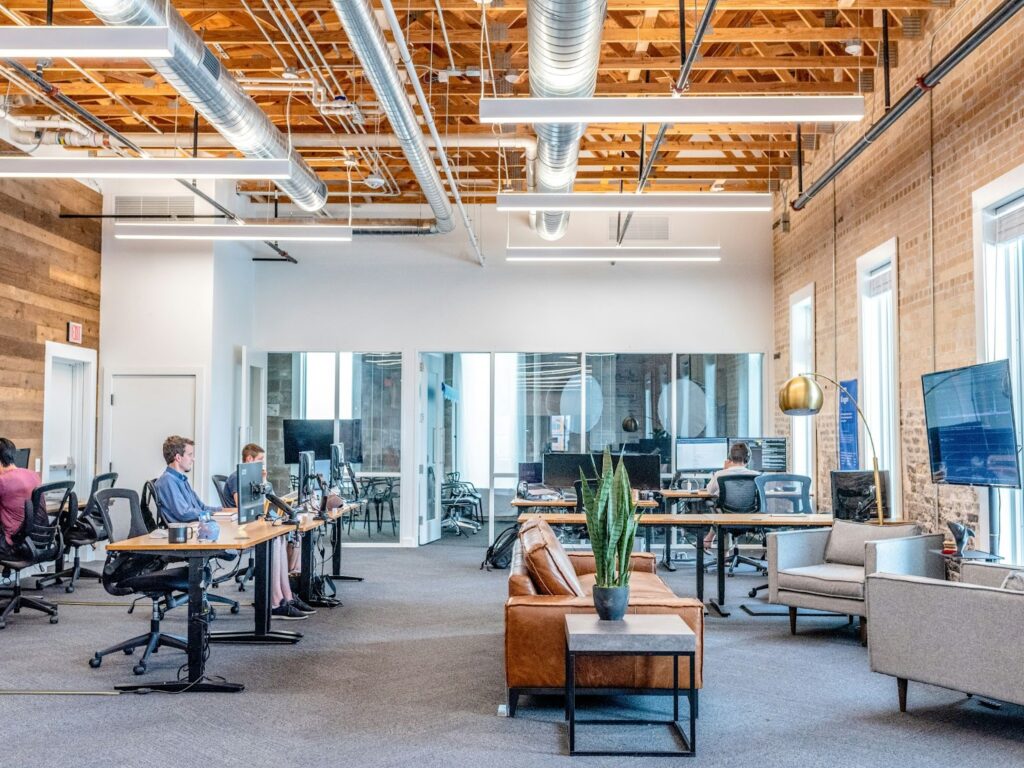 An office with workers at desks. 