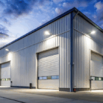 Exterior of a steel industrial building with many garage doors
