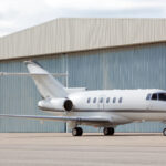 Airplane in front of hangar