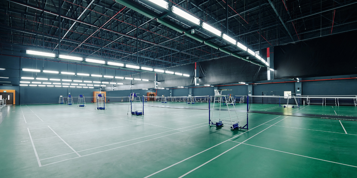 Spacious recreation center building with multiple indoor sports courts