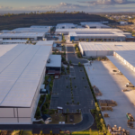 Aerial view of a large industrial park featuring multiple warehouse and distribution facilities. Steel building systems support expansive footprints, fast construction schedules, and scalable space for manufacturing, storage, and logistics operations.