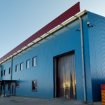 Temperature-controlled industrial building with insulated metal panel construction.